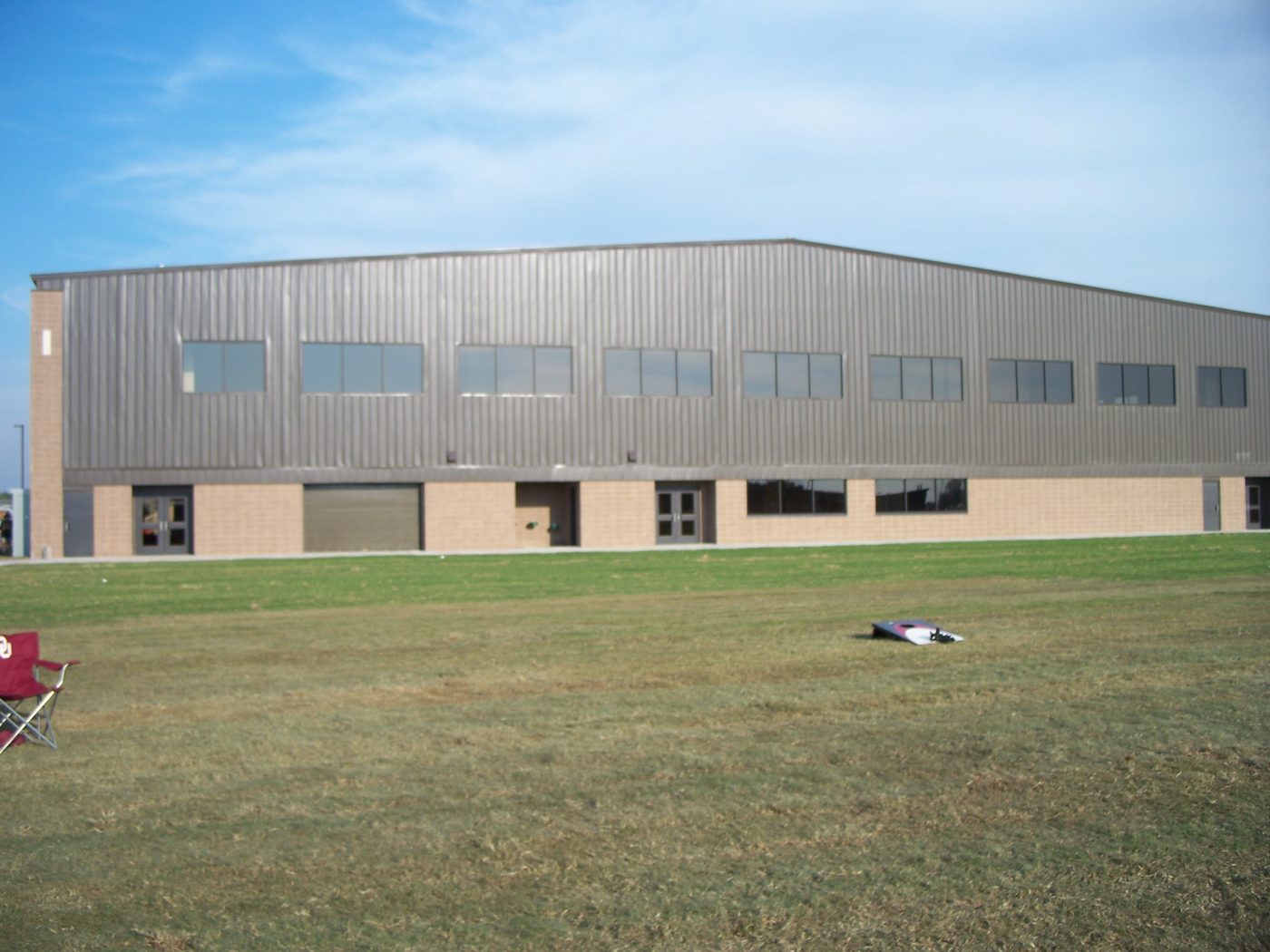Exterior of the OU Tennis Indoor Facility, a metal-clad athletic building