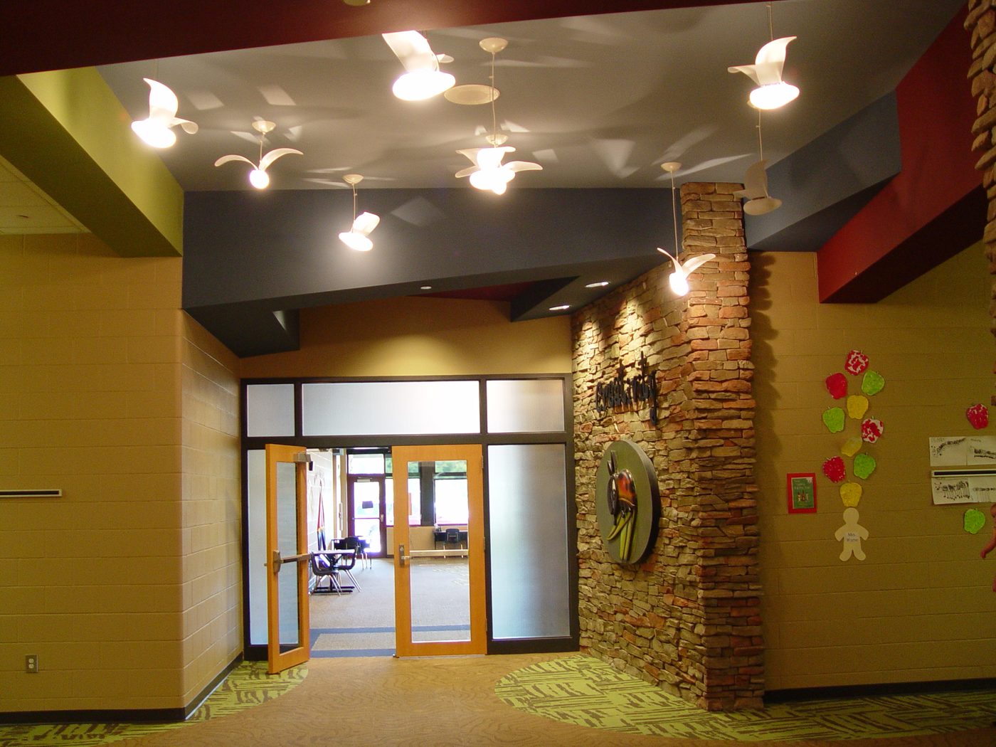Interior lobby with stone accent wall at Stone Canyon Elementary School